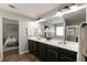 Bathroom featuring a double sink vanity, soaking tub and glass enclosed shower at 3894 Dunaire Dr, Stone Mountain, GA 30083