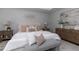 Bedroom with a tray ceiling, and warm neutral decor at 3894 Dunaire Dr, Stone Mountain, GA 30083