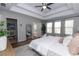 Bright bedroom featuring a tray ceiling, recessed lights, and multiple windows at 3894 Dunaire Dr, Stone Mountain, GA 30083