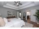 Light and airy bedroom with wood floors, tray ceiling and adjacent bathroom at 3894 Dunaire Dr, Stone Mountain, GA 30083