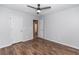 Bedroom with wood-look flooring, ceiling fan and a closet at 3894 Dunaire Dr, Stone Mountain, GA 30083