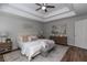 Bedroom with wood floors, a tray ceiling and neutral decor at 3894 Dunaire Dr, Stone Mountain, GA 30083