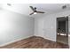 Bedroom with wood-look floors, ceiling fan, and a closet at 3894 Dunaire Dr, Stone Mountain, GA 30083