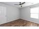 Bedroom featuring a ceiling fan, a window, and a closet at 3894 Dunaire Dr, Stone Mountain, GA 30083