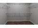 Walk-in closet with wire shelving around all three walls for ample storage at 3894 Dunaire Dr, Stone Mountain, GA 30083