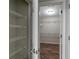 Walk-in closet features an open door and wire shelving for optimal storage space at 3894 Dunaire Dr, Stone Mountain, GA 30083