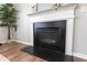 Cozy fireplace featuring a black hearth and mantle with decorative moulding at 3894 Dunaire Dr, Stone Mountain, GA 30083