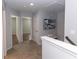 Upstairs landing area with bench seating and neutral carpet at 3894 Dunaire Dr, Stone Mountain, GA 30083
