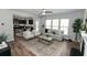 Open concept living area with fireplace, flows into eat-in kitchen with stainless appliances at 3894 Dunaire Dr, Stone Mountain, GA 30083