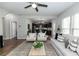 Open living space with eat-in kitchen featuring dark wood cabinetry and stainless appliances at 3894 Dunaire Dr, Stone Mountain, GA 30083