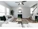 Comfortable living area with a fireplace, hardwood floors, and a ceiling fan at 3894 Dunaire Dr, Stone Mountain, GA 30083