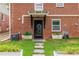 Charming backyard with brick wall, a stone path, and manicured landscaping creating a serene outdoor retreat at 417 Lynnhaven Sw Dr, Atlanta, GA 30310