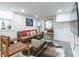 Stylish basement living area with comfortable seating, a cowhide rug and warm lighting ideal for unwinding or entertaining at 417 Lynnhaven Sw Dr, Atlanta, GA 30310