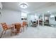 Cozy finished basement living area with a round table, orange chairs, and space for entertaining guests at 417 Lynnhaven Sw Dr, Atlanta, GA 30310