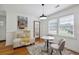 Bright dining area with modern lighting, a comfortable bench, and decorative rug at 417 Lynnhaven Sw Dr, Atlanta, GA 30310