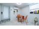 Bright dining area with orange table set next to a door and window with natural light at 417 Lynnhaven Sw Dr, Atlanta, GA 30310