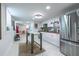 Open kitchen space with stainless steel appliances, a dining area, and natural light at 417 Lynnhaven Sw Dr, Atlanta, GA 30310