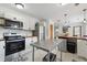 Bright modern kitchen with stainless steel appliances, white cabinets, and butcher block countertops at 417 Lynnhaven Sw Dr, Atlanta, GA 30310