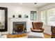 Inviting living room featuring a classic fireplace, hardwood floors and lots of light at 417 Lynnhaven Sw Dr, Atlanta, GA 30310