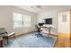Bright office space with modern desk, chair, and large monitor mounted to the wall, perfect for productivity at 417 Lynnhaven Sw Dr, Atlanta, GA 30310