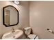 Cozy bathroom with a sleek vessel sink and a stylish framed mirror at 5987 Turfway Park Ct, Sugar Hill, GA 30518