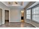 Bright bedroom with hardwood floors and doors leading to the closet and bathroom at 5987 Turfway Park Ct, Sugar Hill, GA 30518