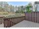 Nice view from the spacious deck with wooden railing at 5987 Turfway Park Ct, Sugar Hill, GA 30518