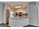Modern kitchen boasting white cabinets, stainless steel appliances, and stylish tile backsplash at 5987 Turfway Park Ct, Sugar Hill, GA 30518