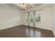 This is a spacious bedroom with hardwood floors, paneled accent wall, and tray ceiling at 1962 Bainbridge Ln, Atlanta, GA 30345