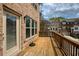Brick townhome with a wooden deck providing a private outdoor living space at 1962 Bainbridge Ln, Atlanta, GA 30345