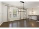 Spacious dining room features hardwood floors, large windows, and modern chandelier at 1962 Bainbridge Ln, Atlanta, GA 30345