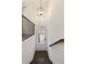 Staircase leading to the entryway with white walls, dark wood floors and iron railings at 1962 Bainbridge Ln, Atlanta, GA 30345