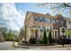 Beautiful brick townhome with manicured landscaping and covered entry on a tree lined street at 1962 Bainbridge Ln, Atlanta, GA 30345