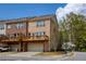 Two-story brick townhome with attached garage and private balcony at 1962 Bainbridge Ln, Atlanta, GA 30345