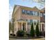 Charming brick townhome with manicured landscaping, dark shutters, and covered entry at 1962 Bainbridge Ln, Atlanta, GA 30345