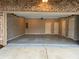Spacious two car garage with brick walls and two white doors at 1962 Bainbridge Ln, Atlanta, GA 30345