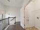 Hallway with railing, open door to laundry room, and hardwood floors at 1962 Bainbridge Ln, Atlanta, GA 30345