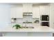 Bright kitchen features white cabinets, stainless steel appliances, and a large center island at 1962 Bainbridge Ln, Atlanta, GA 30345
