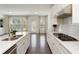 Bright and open kitchen features white cabinetry, stainless steel appliances, and outdoor access at 1962 Bainbridge Ln, Atlanta, GA 30345