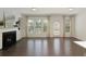 Cozy living room with a fireplace, large windows, and access to the outdoor patio at 1962 Bainbridge Ln, Atlanta, GA 30345