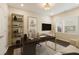 Home office with sleek desk, modern shelving, and plenty of natural light from the windows at 1962 Bainbridge Ln, Atlanta, GA 30345