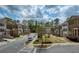 Street view of community with townhomes, well-maintained landscaping, and convenient parking at 1962 Bainbridge Ln, Atlanta, GA 30345