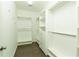 Walk-in closet with wood flooring and custom shelving at 1962 Bainbridge Ln, Atlanta, GA 30345