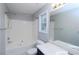 Clean bathroom with a tub, shower combo, single vanity, and a large mirror at 301 Thorn Thicket Dr, Rockmart, GA 30153