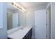 Well-lit bathroom with vanity, mirror and access to shower and toilet room at 301 Thorn Thicket Dr, Rockmart, GA 30153