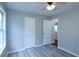 Bedroom with hardwood floors and two doors at 301 Thorn Thicket Dr, Rockmart, GA 30153