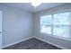 Bedroom with hardwood floors, natural light, and neutral colors at 301 Thorn Thicket Dr, Rockmart, GA 30153