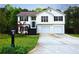 Charming two-story home with a well-maintained lawn, a two-car garage and a welcoming front porch at 301 Thorn Thicket Dr, Rockmart, GA 30153