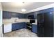 Kitchen boasts stainless appliances and ample cabinet space at 301 Thorn Thicket Dr, Rockmart, GA 30153