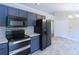 Kitchen boasts stainless appliances and ample cabinet space at 301 Thorn Thicket Dr, Rockmart, GA 30153